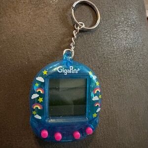 Giga Pets Virtual Unicorn key chain toy, used battery included
Blue color